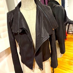 Black jacket zise large. With zippers . Suede material . Very soft.